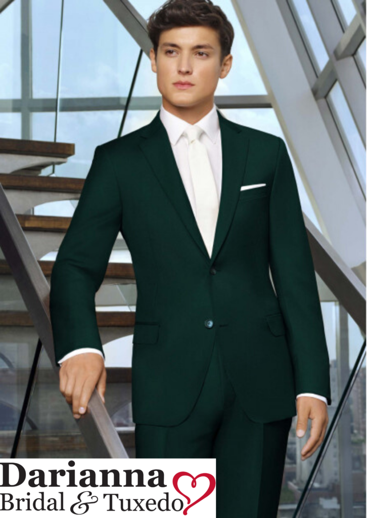 Model in hunter green color suit with long white tie and matching pocket square, perfect for holiday galas