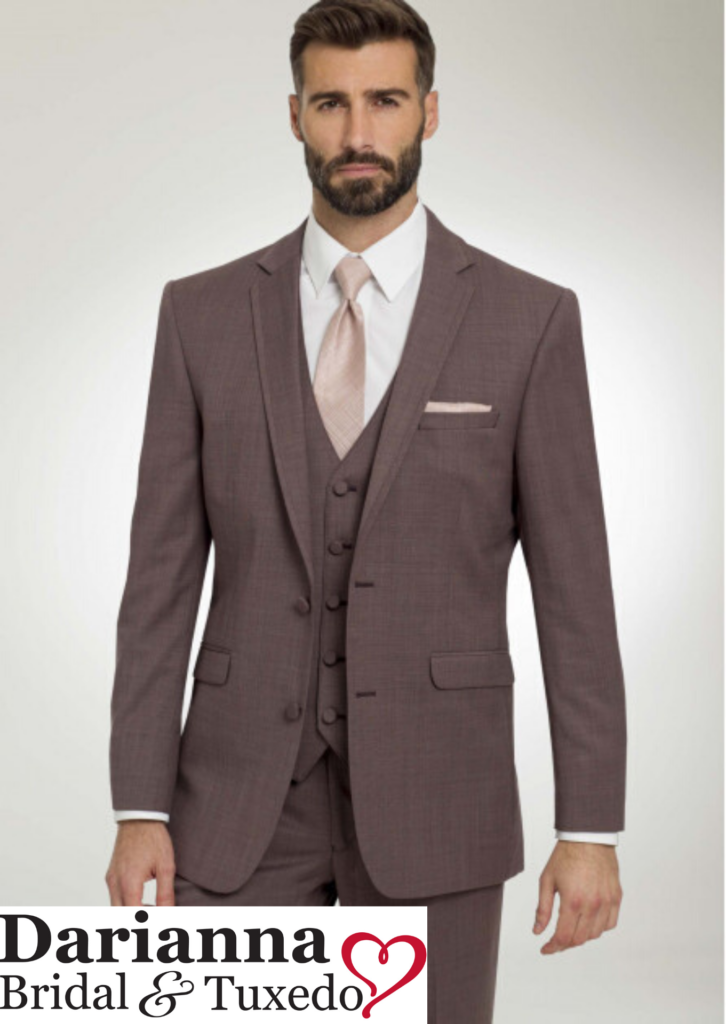 Model in Mulberry colored tuxedo with matching vest and pants, long blush color tie, perfect for holiday galas